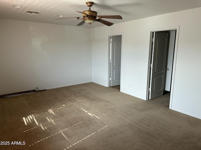 carpeted empty room with ceiling fan