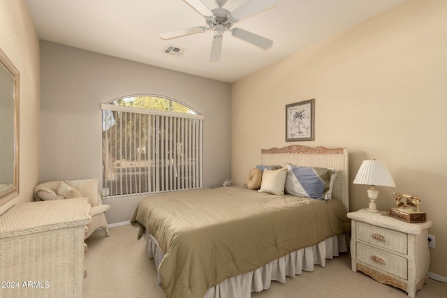 bedroom with light carpet and ceiling fan