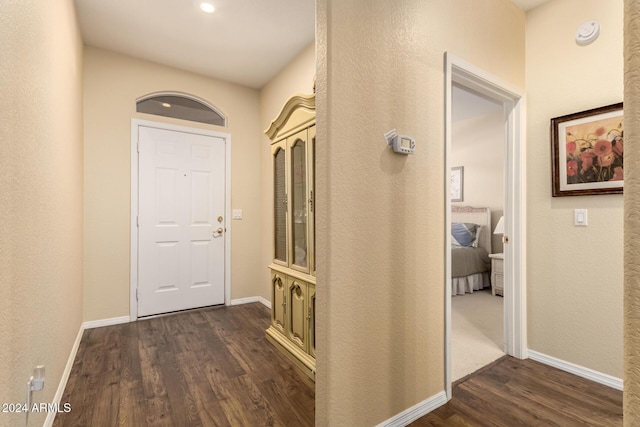 hall featuring dark wood-type flooring