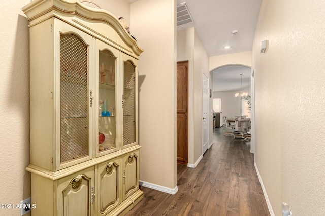 hall with dark hardwood / wood-style floors