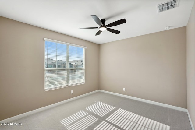 spare room with carpet floors and ceiling fan