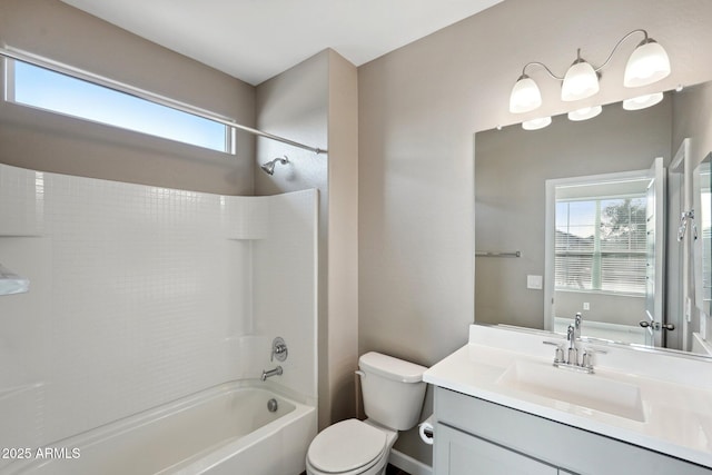 full bathroom featuring vanity, plenty of natural light, toilet, and  shower combination