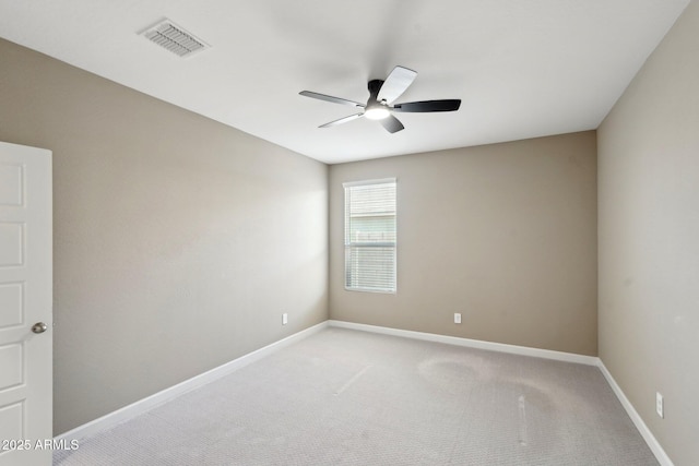 spare room with carpet floors and ceiling fan