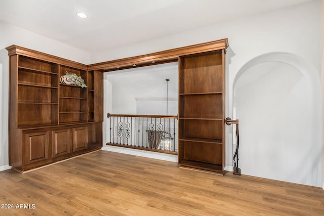 spare room with wood finished floors, recessed lighting, and baseboards
