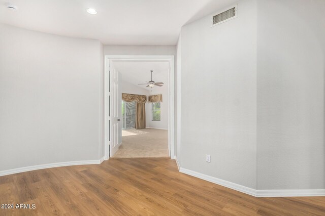 unfurnished room featuring a smoke detector, baseboards, wood finished floors, recessed lighting, and a ceiling fan