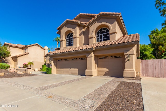 mediterranean / spanish-style home featuring a garage