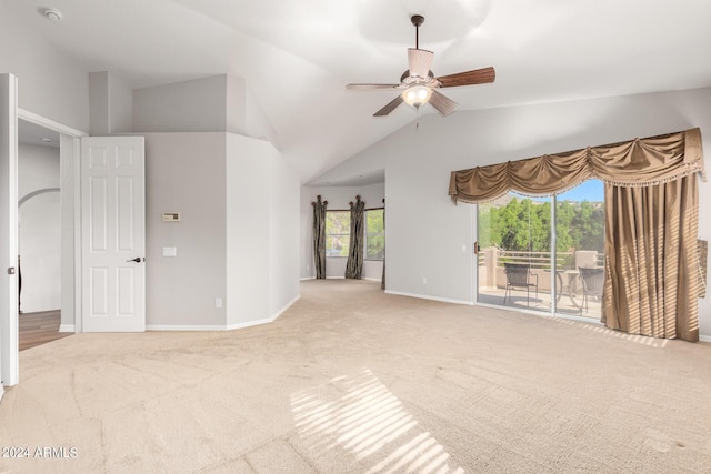 unfurnished living room featuring light carpet, ceiling fan, baseboards, and lofted ceiling
