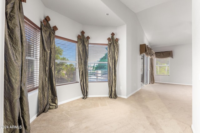 empty room with carpet floors and baseboards