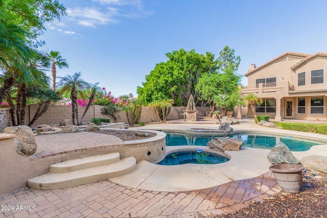 view of pool featuring an in-ground hot tub, a patio area, and a fenced backyard