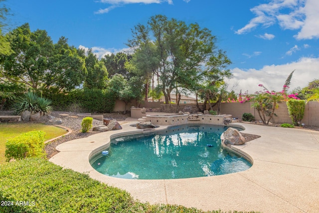 view of pool featuring a patio area and a fenced backyard