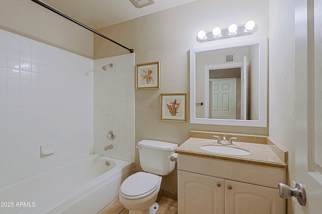 full bath featuring a textured wall, tile patterned flooring, toilet, vanity, and  shower combination