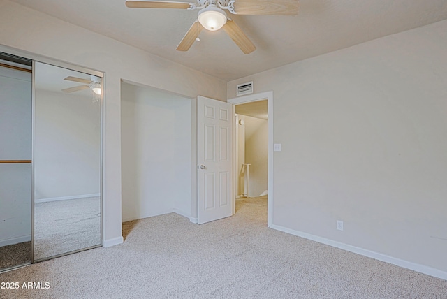 unfurnished bedroom with baseboards, a closet, visible vents, and carpet flooring