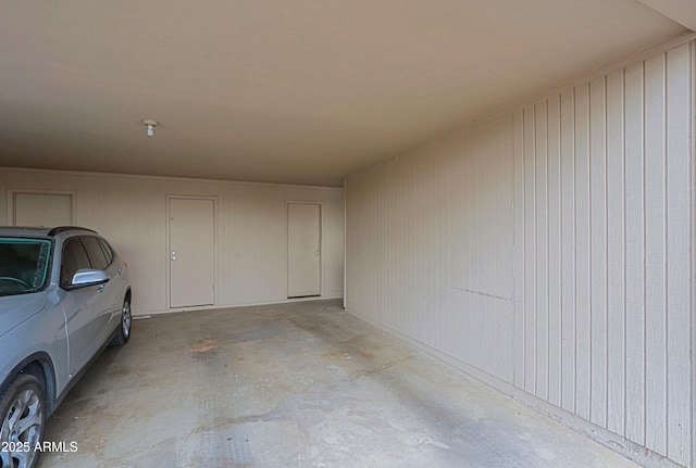 garage featuring a carport