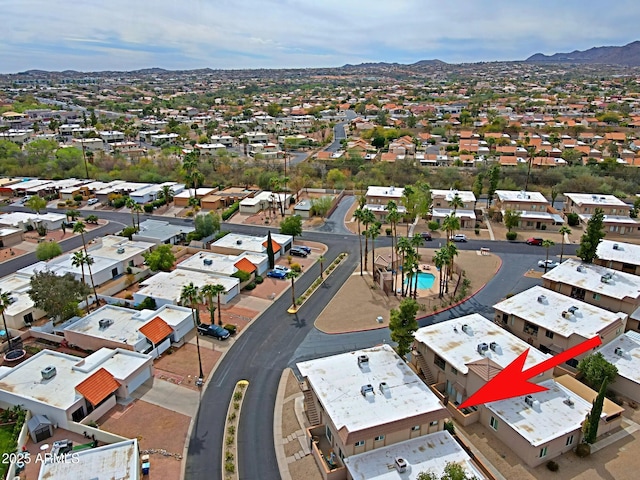 birds eye view of property with a residential view and a mountain view