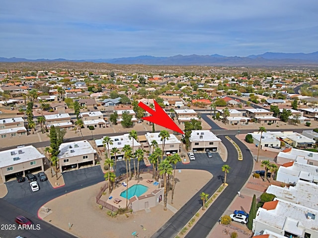 drone / aerial view featuring a residential view and a mountain view