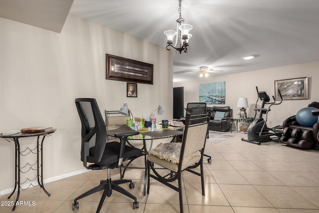 dining room with light tile patterned floors, baseboards, and ceiling fan with notable chandelier