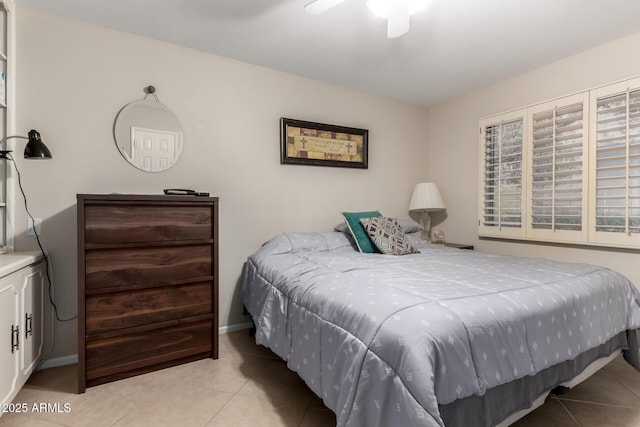 bedroom featuring light tile patterned flooring, ceiling fan, and baseboards