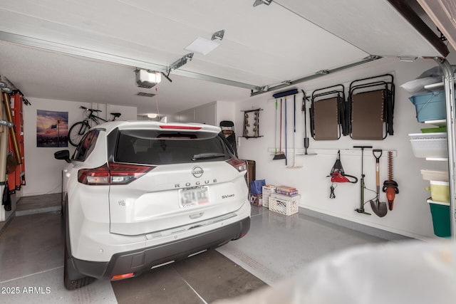 garage featuring a garage door opener