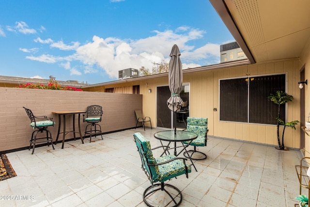 view of patio featuring fence and central AC unit