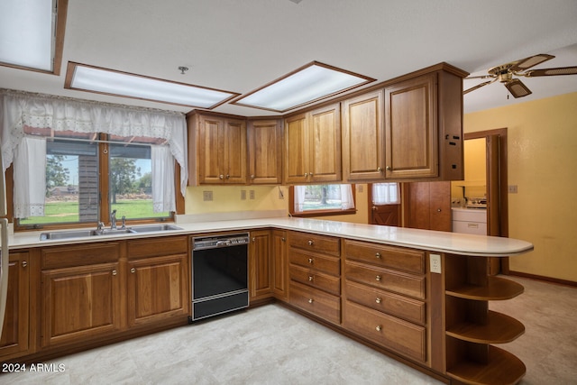 kitchen featuring kitchen peninsula, ceiling fan, dishwasher, and sink