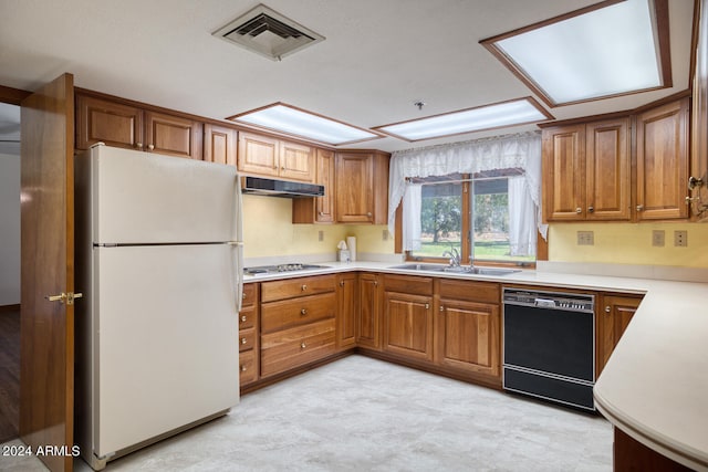 kitchen with sink and white appliances