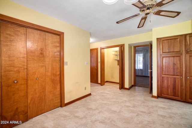 unfurnished bedroom featuring ceiling fan