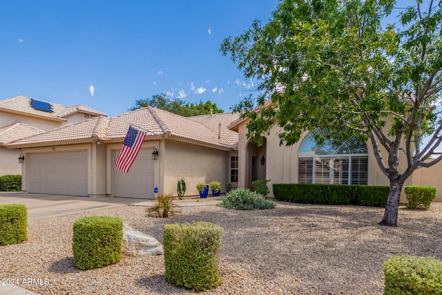 view of front of property with a garage