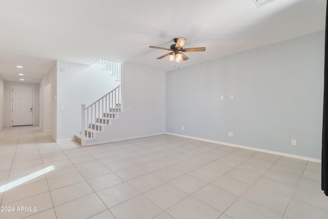 spare room with light tile patterned floors and ceiling fan