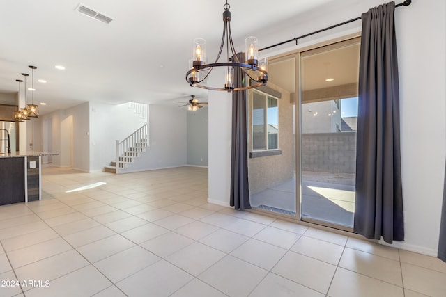 spare room featuring light tile patterned flooring and ceiling fan