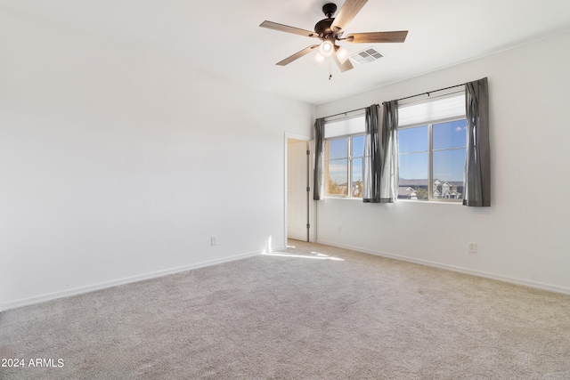 carpeted empty room with ceiling fan