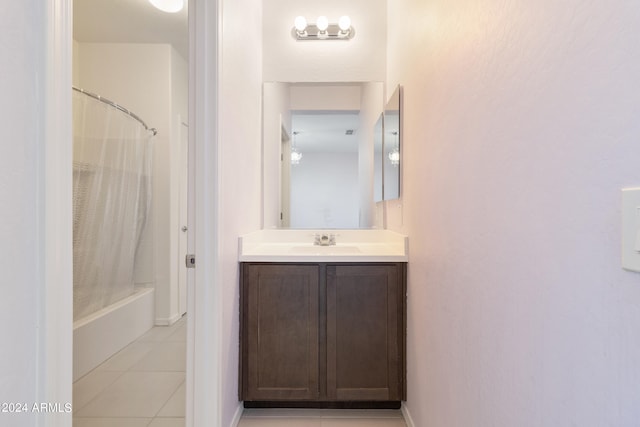 bathroom with vanity, shower / bath combination with curtain, and tile patterned floors