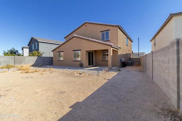 rear view of house with a patio