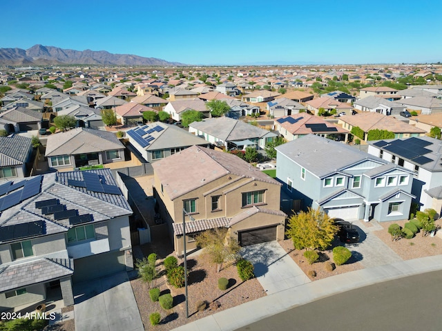 birds eye view of property with a mountain view