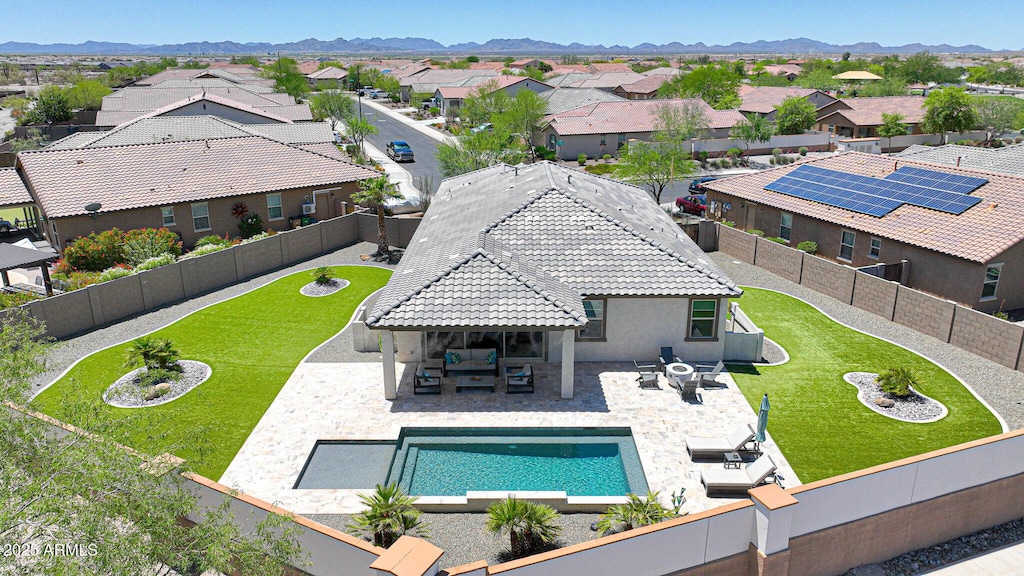 18000 W Thistle Landing Dr, Goodyear, AZ 85338 - view of swimming pool featuring a residential view, a patio, an outdoor living space, a mountain view, and outdoor dining space