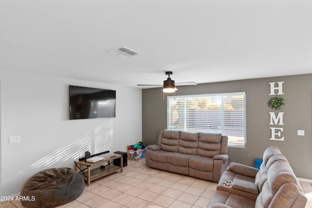 tiled living room featuring ceiling fan