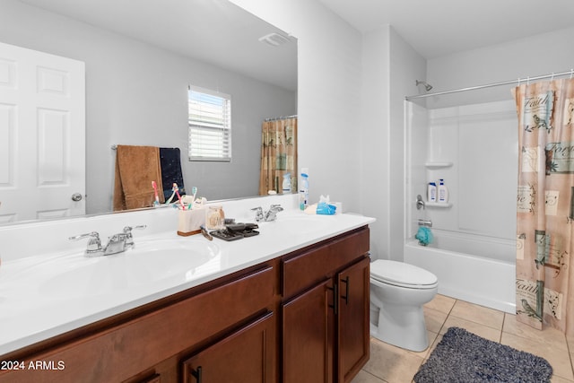 full bathroom featuring tile patterned flooring, shower / bath combination with curtain, vanity, and toilet