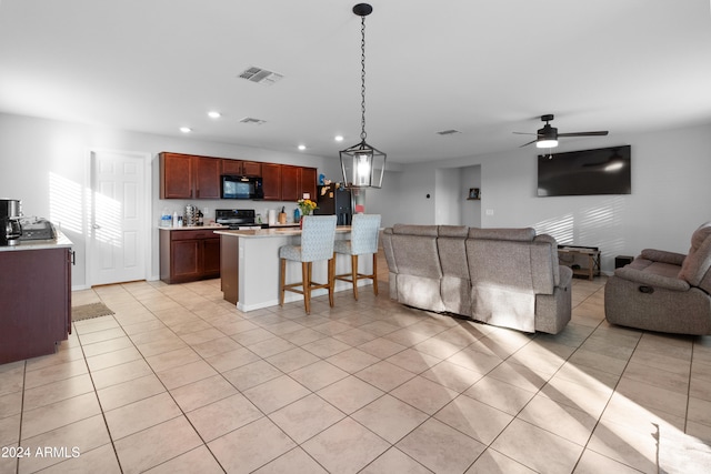 interior space with ceiling fan and light tile patterned flooring