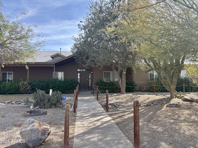 view of front of house featuring stucco siding