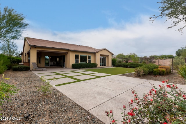 back of property featuring a garage