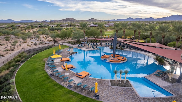 view of pool featuring a mountain view and a patio area