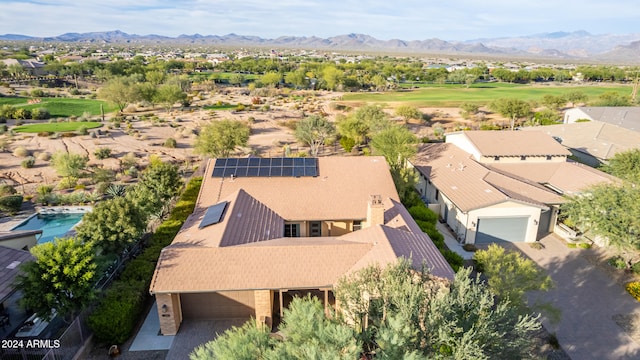 birds eye view of property with a mountain view