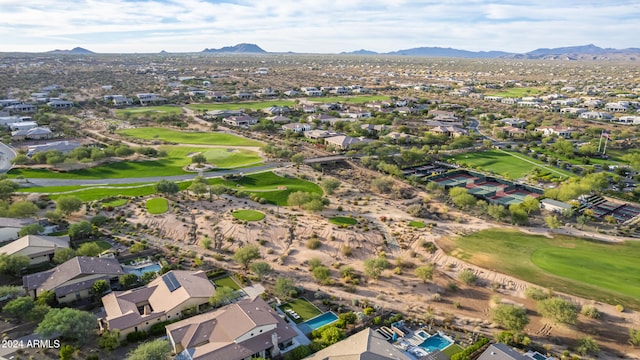 birds eye view of property featuring a mountain view