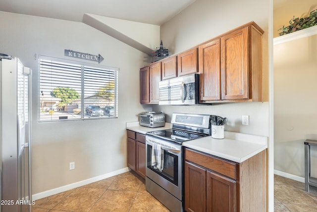 kitchen featuring appliances with stainless steel finishes and light tile patterned floors