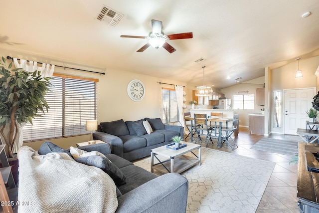 tiled living room featuring vaulted ceiling and ceiling fan