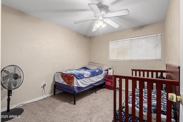 bedroom with ceiling fan and carpet