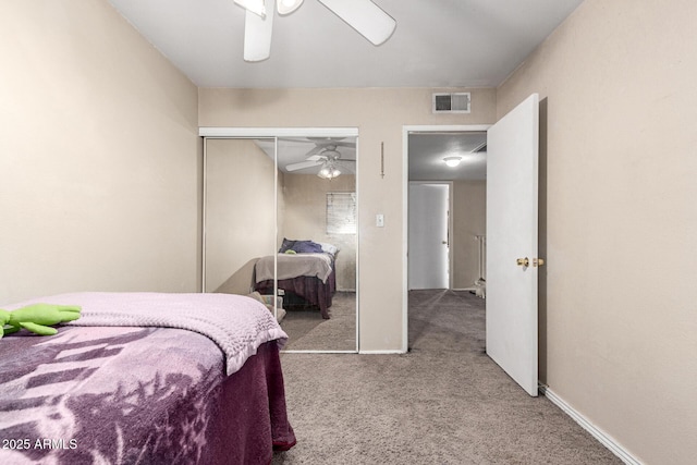 carpeted bedroom featuring a closet and ceiling fan