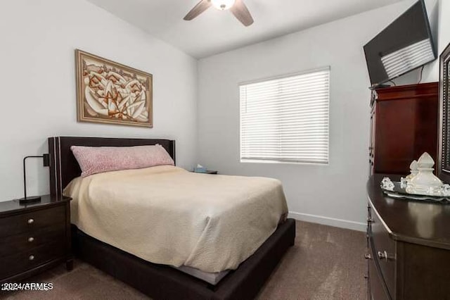 bedroom with dark colored carpet and ceiling fan