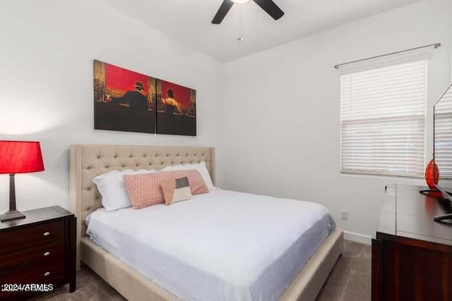 bedroom featuring ceiling fan and dark hardwood / wood-style floors