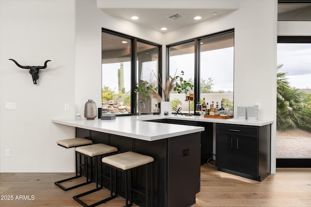 30600 N Pima Rd Unit 89, Scottsdale, AZ 85266 - bar featuring visible vents, recessed lighting, light wood-style floors, and a healthy amount of sunlight