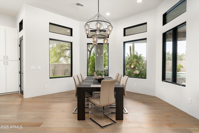 30600 N Pima Rd Unit 89, Scottsdale, AZ 85266 - dining room with visible vents, light wood-style flooring, plenty of natural light, and a notable chandelier